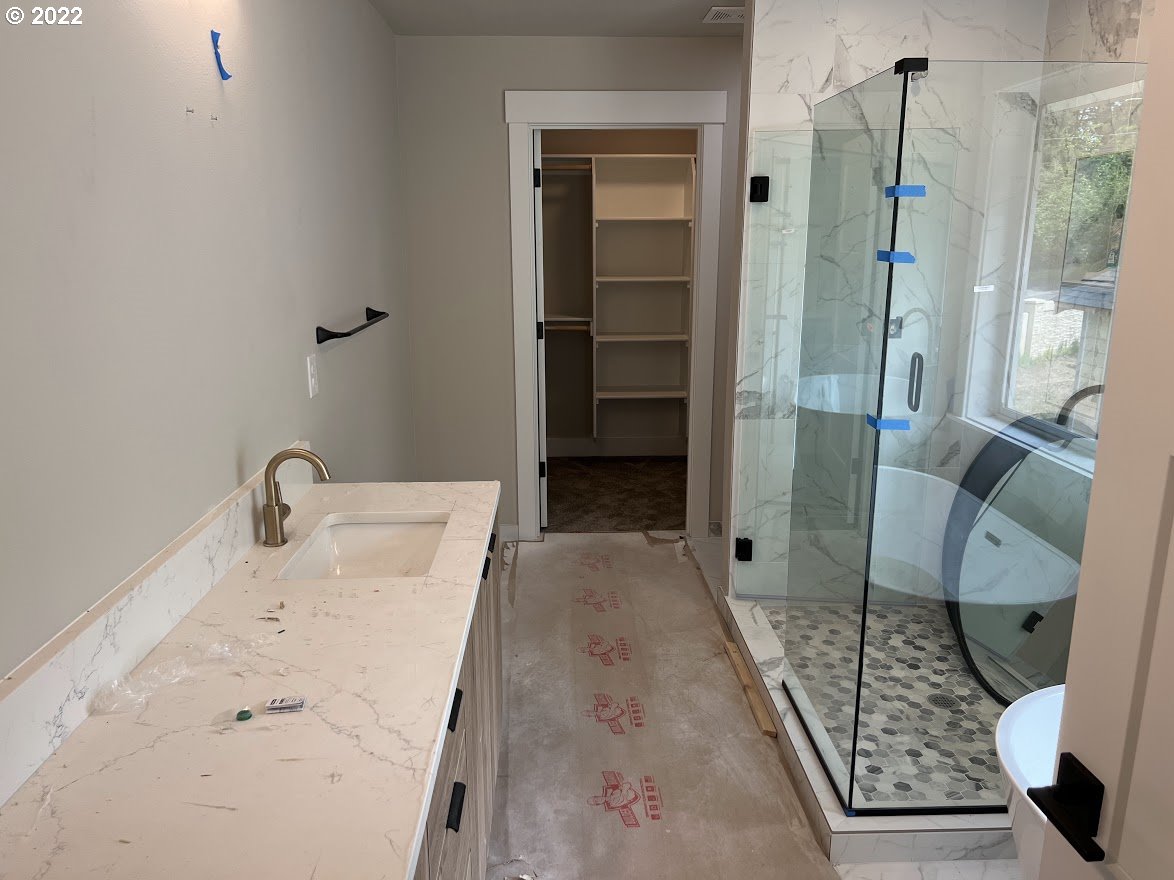 3901 South Hay Field Circle Ridgefield, WA 98642 - Photo 20 of 30 a bathroom with a sink a toilet a mirror and shower