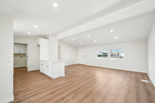a view of a kitchen with wooden floor