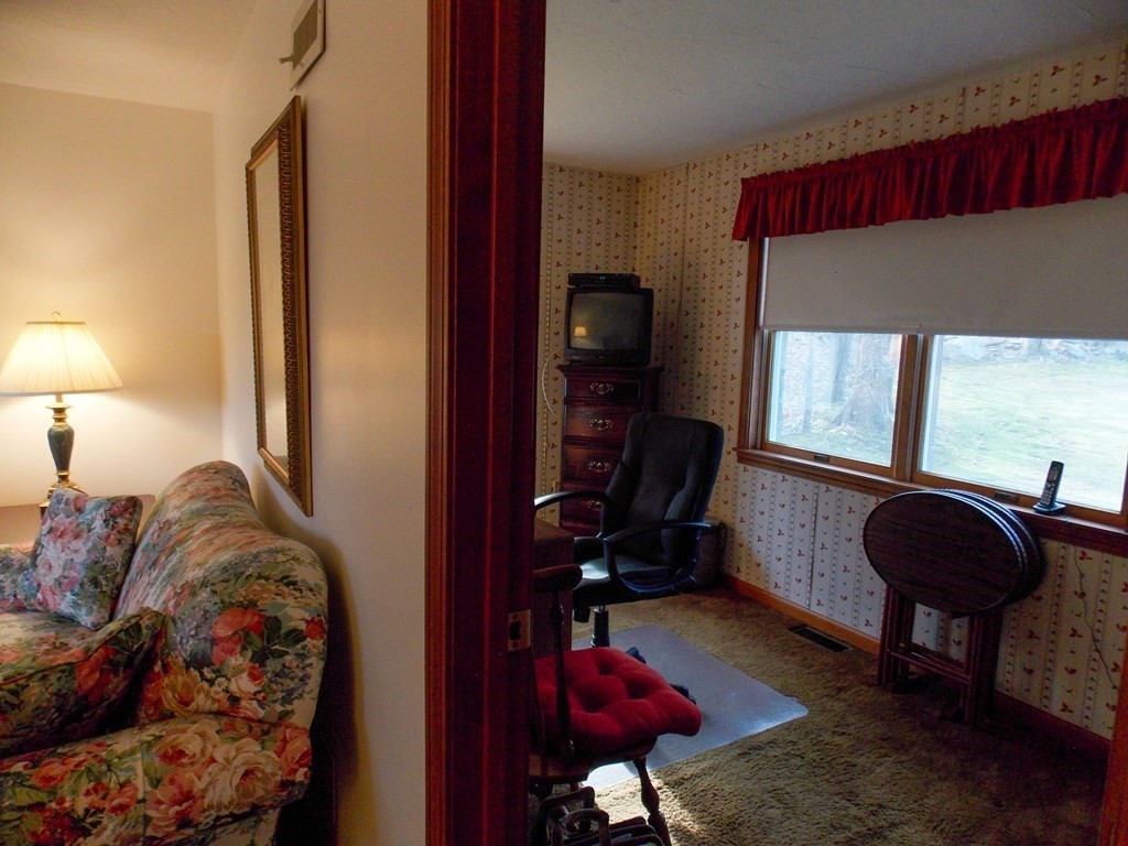 22 Lantern Lane Worcester, MA 01609 - Photo 16 of 32 a living room with furniture and a window