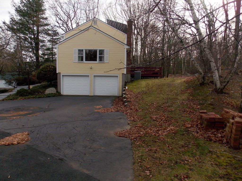 22 Lantern Lane Worcester, MA 01609 - Photo 2 of 32 a front view of house with yard and trees