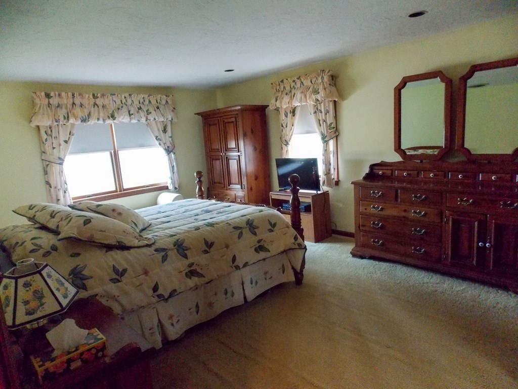 22 Lantern Lane Worcester, MA 01609 - Photo 22 of 32 a bedroom with a bed and a dresser