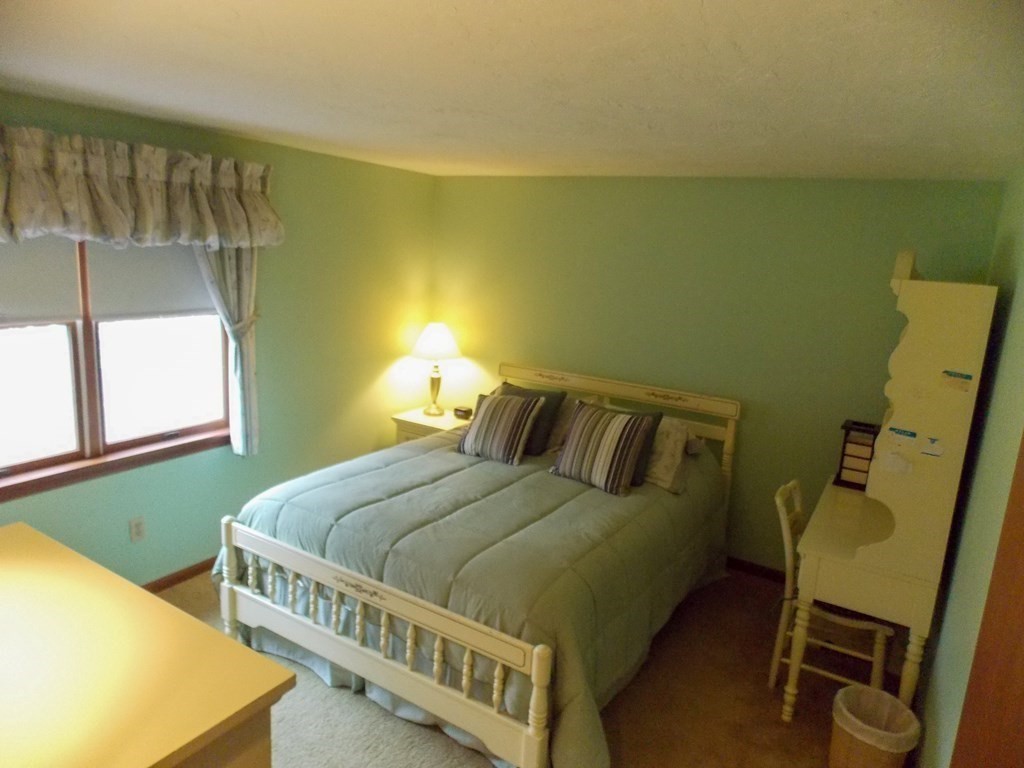 22 Lantern Lane Worcester, MA 01609 - Photo 24 of 32 a bedroom with a bed and windows