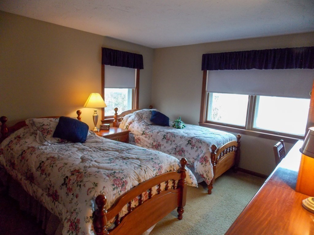 22 Lantern Lane Worcester, MA 01609 - Photo 25 of 32 a bedroom with two beds and painting on the wall