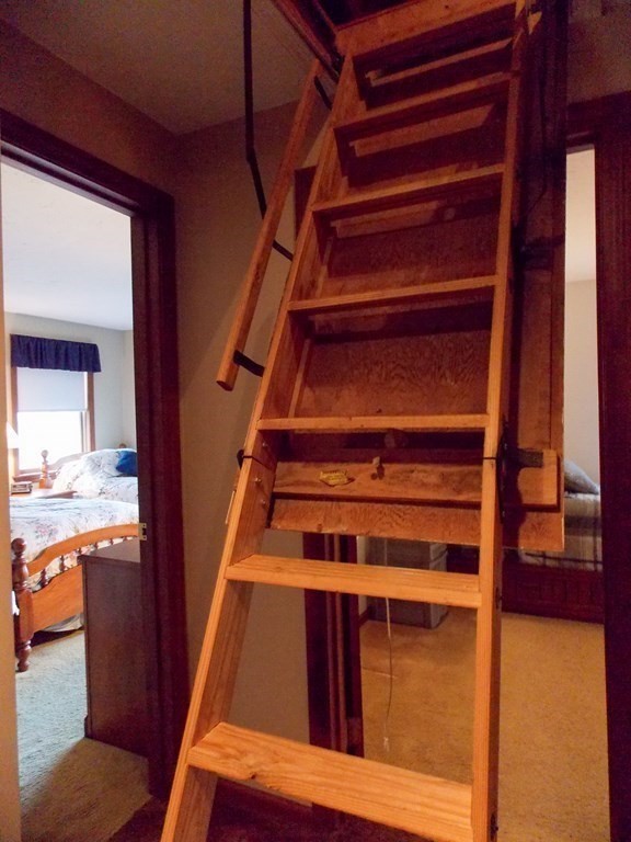 22 Lantern Lane Worcester, MA 01609 - Photo 29 of 32 a view of an empty room with wooden floor and furniture
