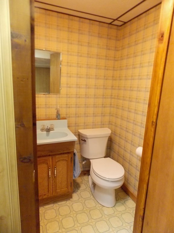 22 Lantern Lane Worcester, MA 01609 - Photo 31 of 32 a white toilet sitting next to a bathroom sink