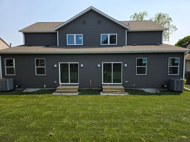 a house that has a big yard in front of it