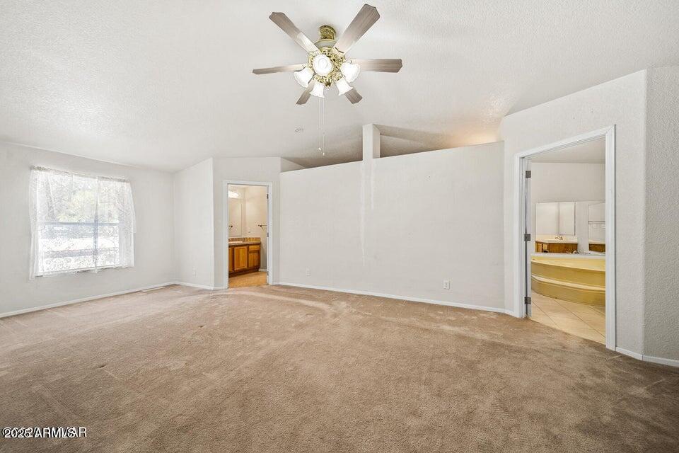 2421 West Thornton Road Show Low, AZ 85901 - Photo 19 of 48 a view of an empty room with a window