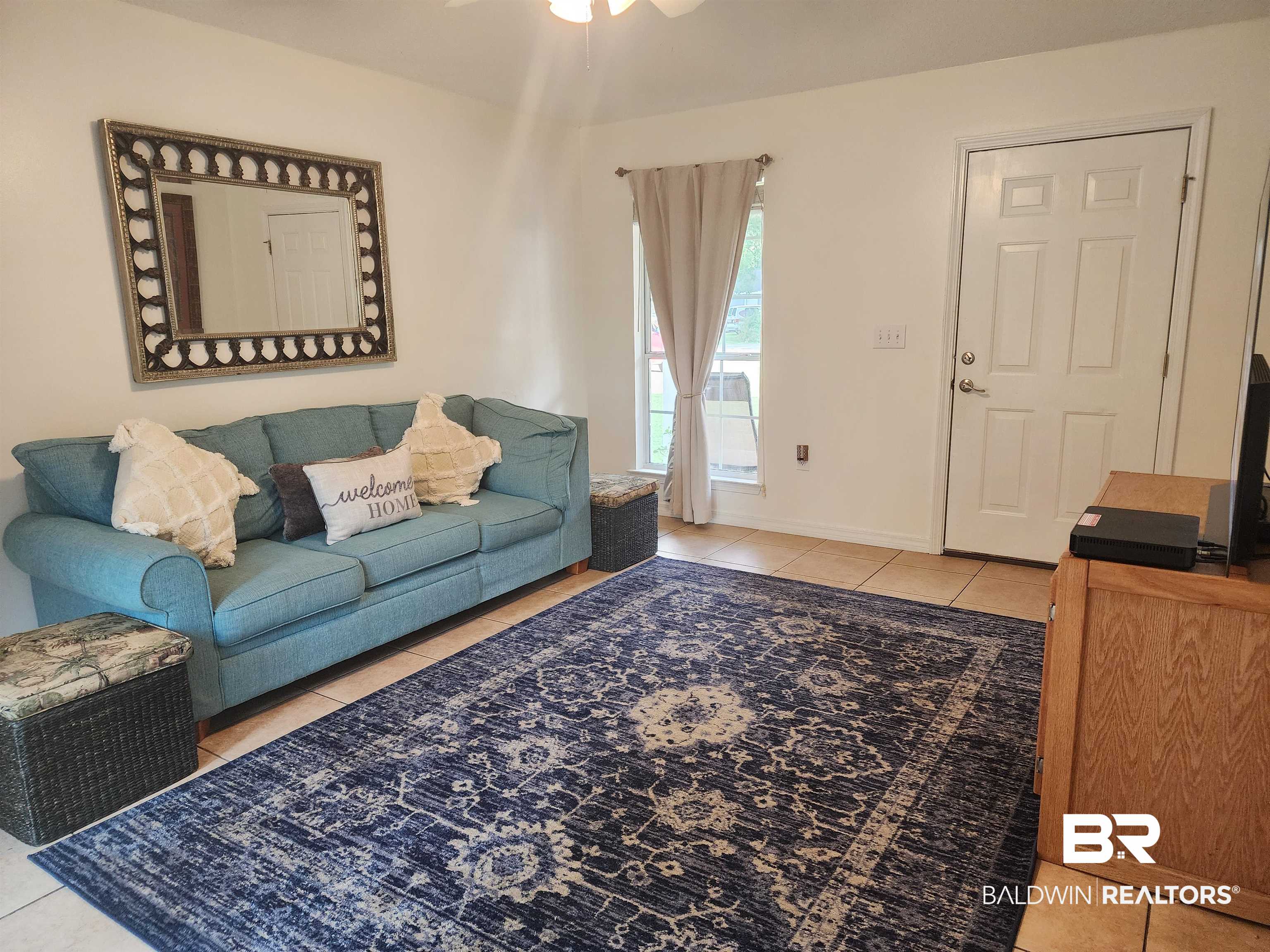 431 Hamilton Boulevard Foley, AL 36535 - Photo 3 of 30 Living room with light tile patterned flooring.