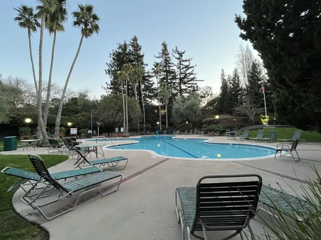 a view of a park with sitting area