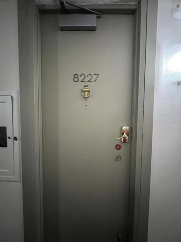 a view of a house with a tree