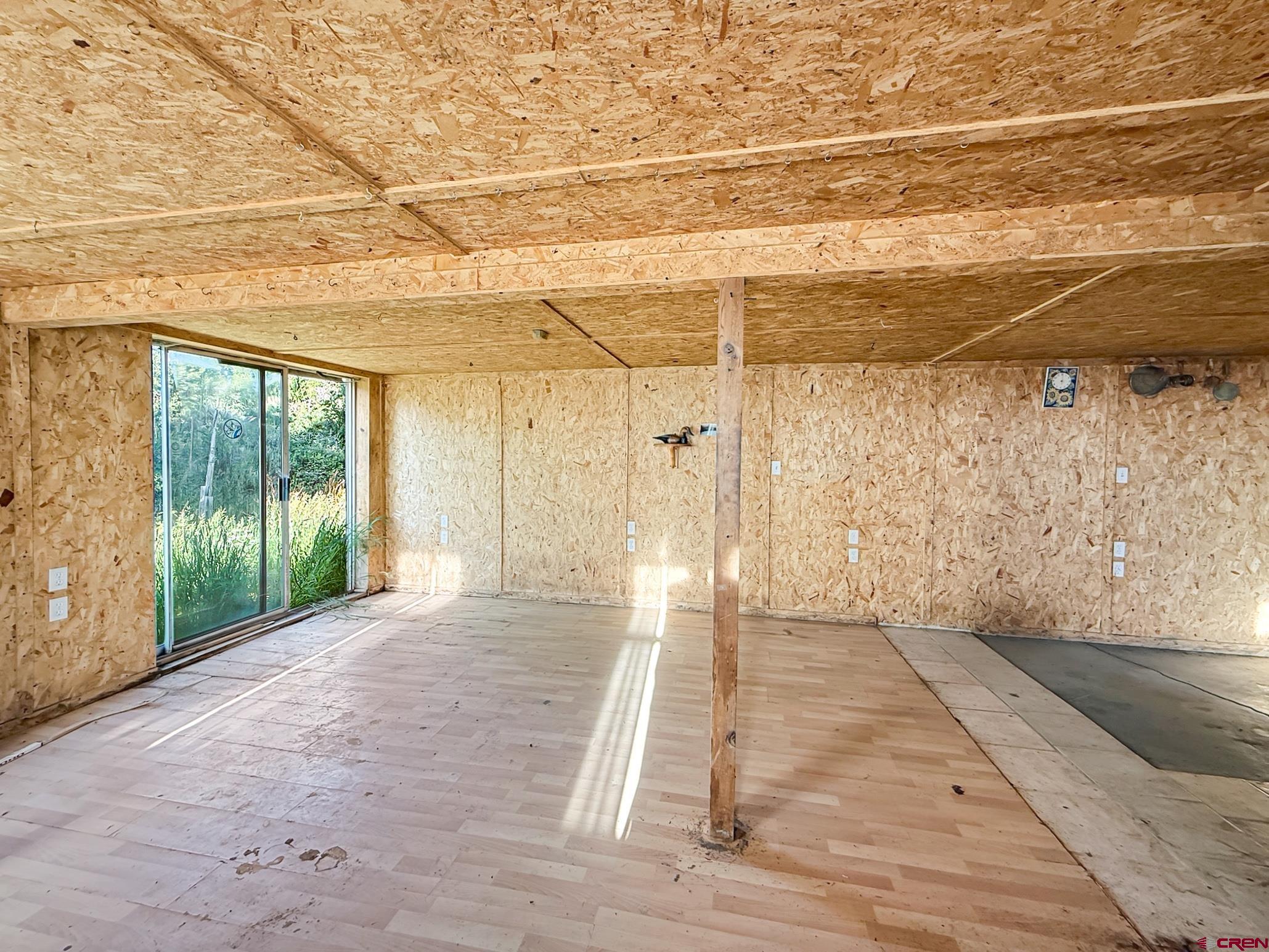 43867 Long Gulch Road Crawford, CO 81415 - Photo 21 of 45 a view of a room with wooden floor and windows