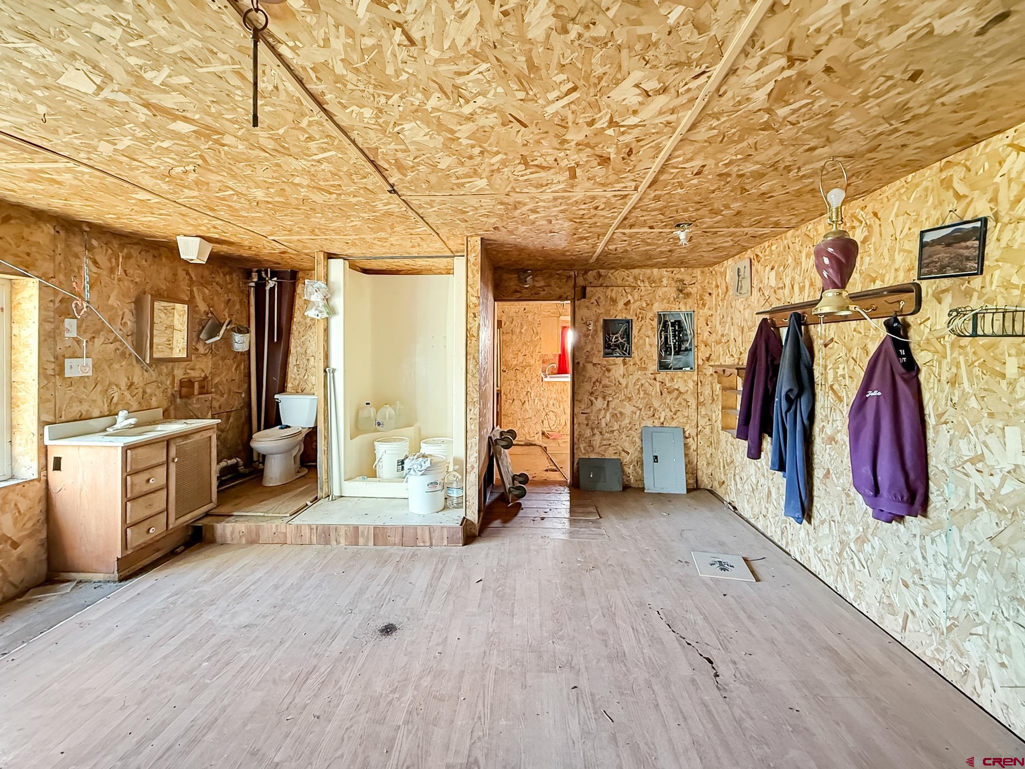 43867 Long Gulch Road Crawford, CO 81415 - Photo 23 of 45 a view of a walk in closet with clothes and shoes