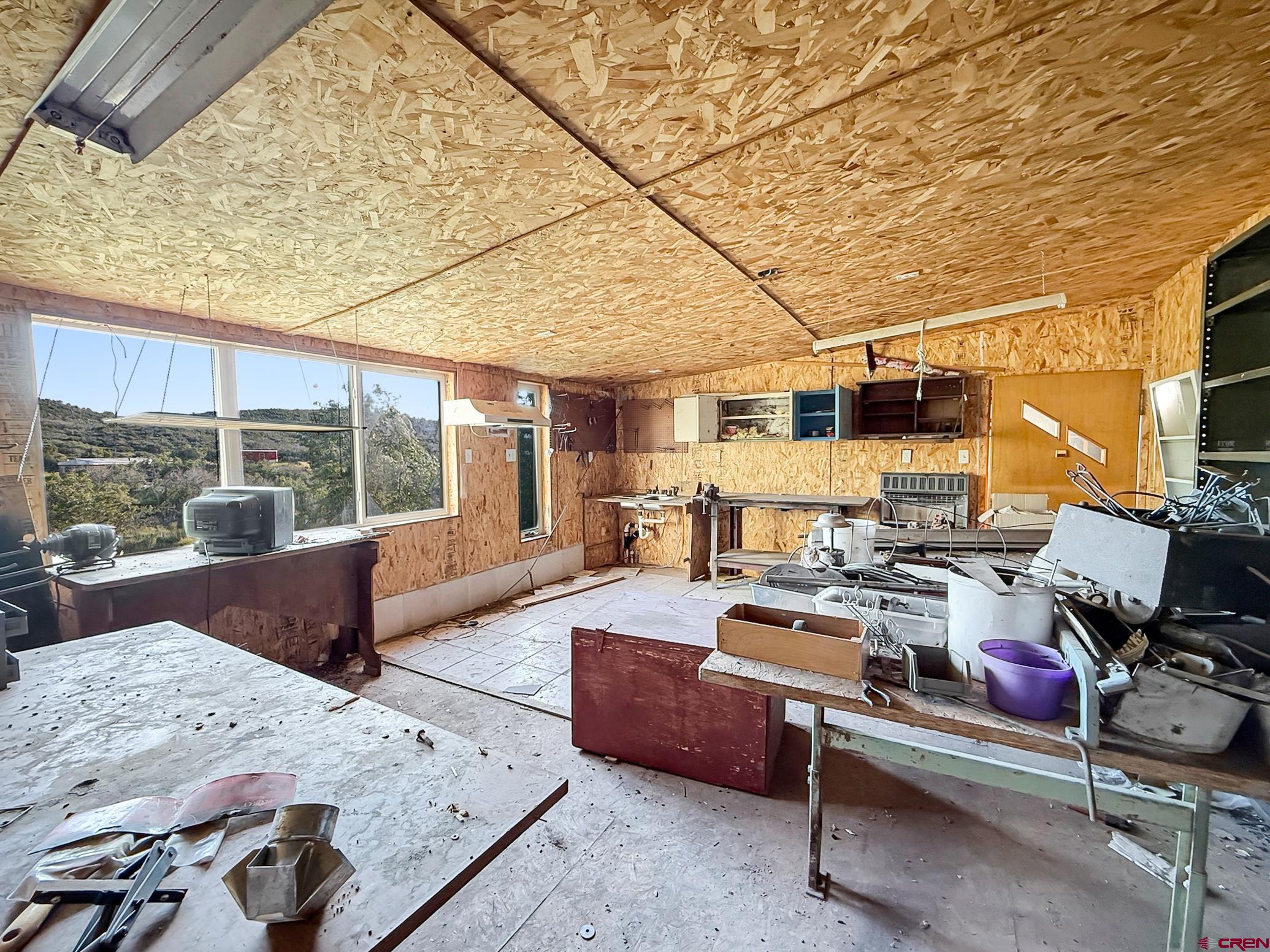43867 Long Gulch Road Crawford, CO 81415 - Photo 28 of 45 a bedroom with furniture and a large window