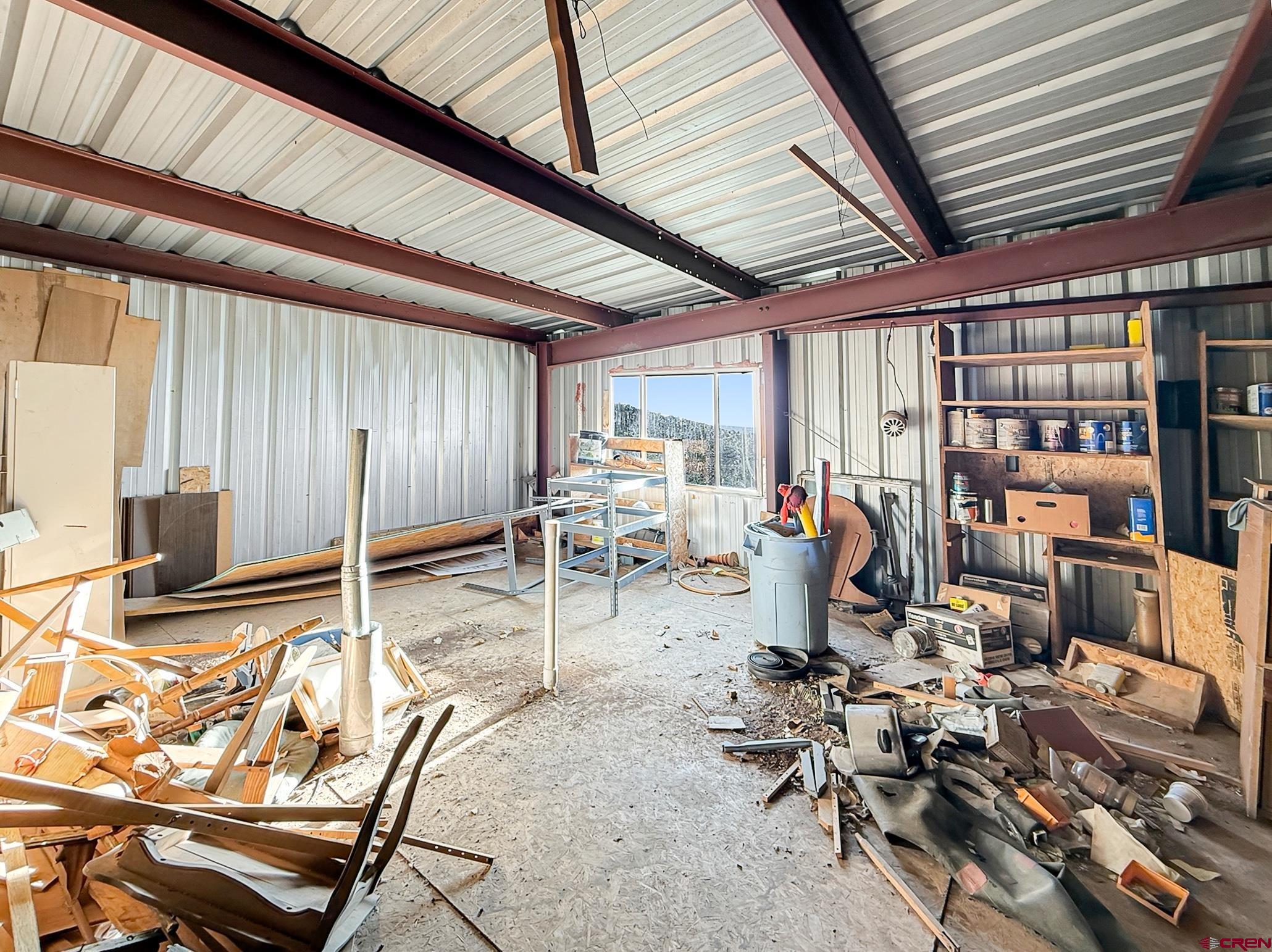 43867 Long Gulch Road Crawford, CO 81415 - Photo 31 of 45 a room with lots of furniture and white walls
