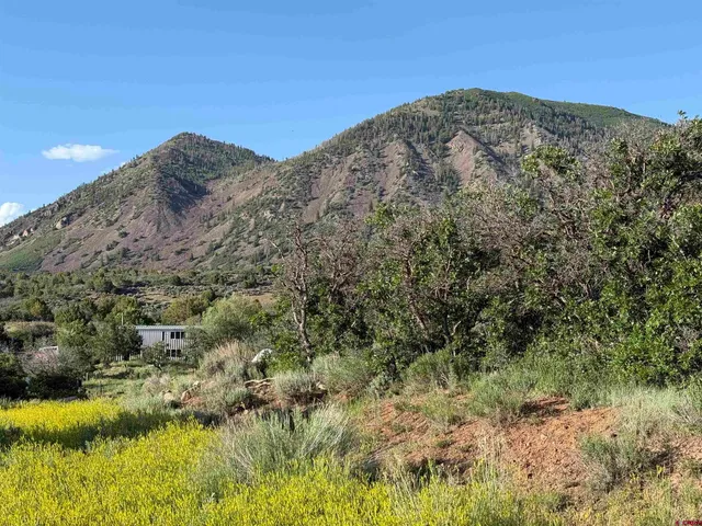 a view of a patio with table and chairs