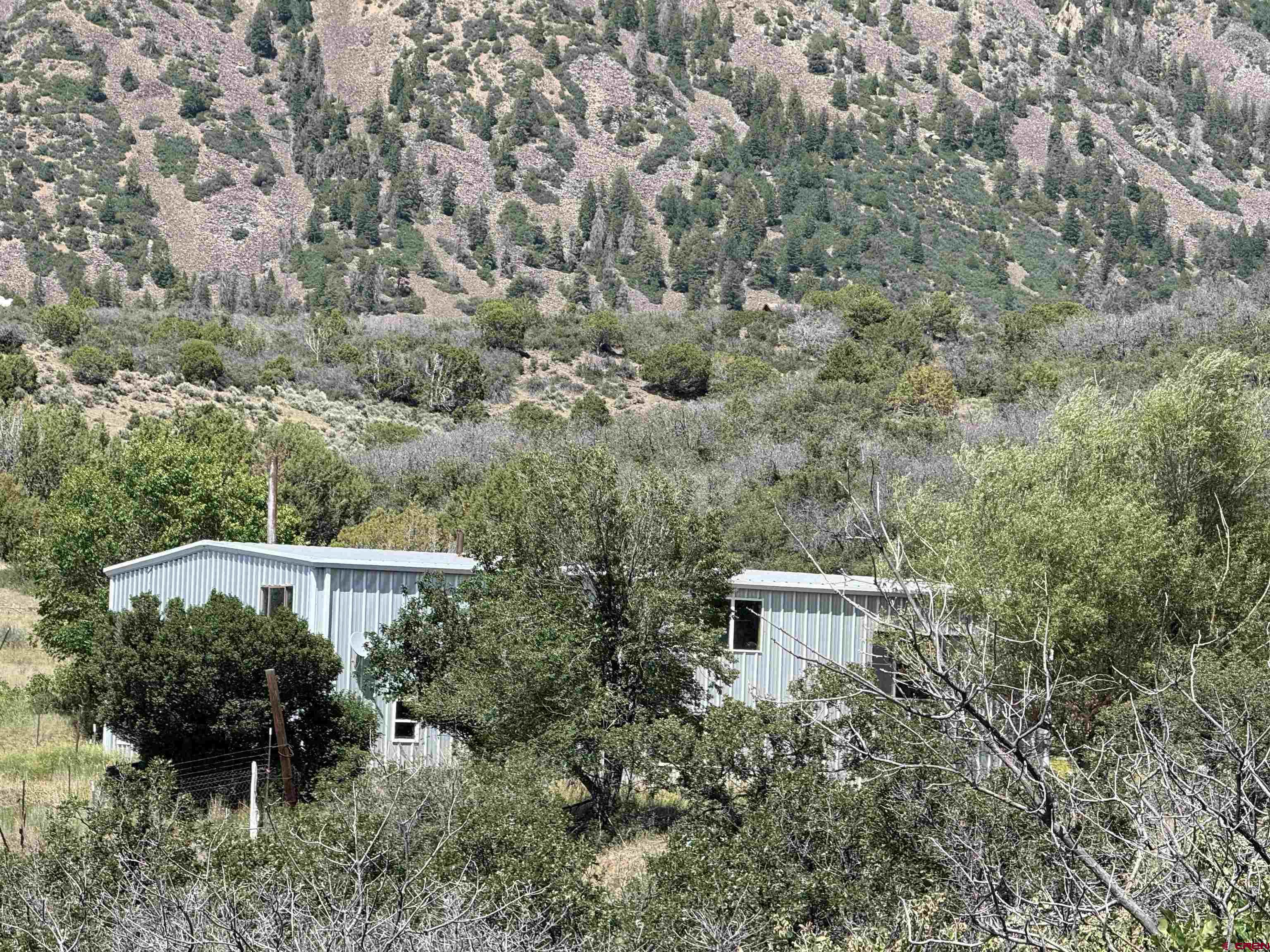 43867 Long Gulch Road Crawford, CO 81415 - Photo 41 of 45 an aerial view of a house with a yard and lake view