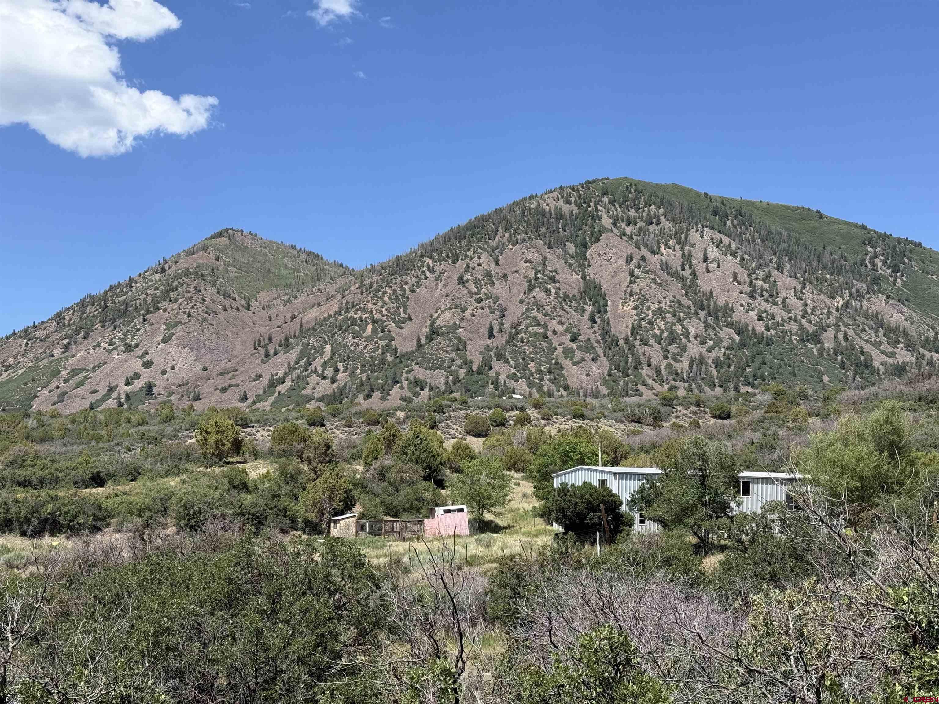 43867 Long Gulch Road Crawford, CO 81415 - Photo 42 of 45 a view of a mountain in the distance in a field