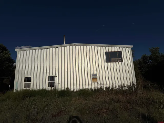 a view of a lake in middle of forest