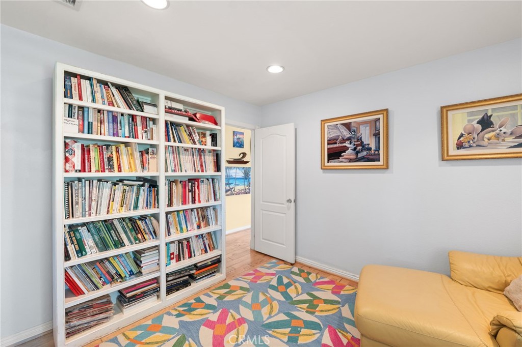 16620 Rocky Glen Road Perris, CA 92570 - Photo 23 of 72 a bedroom with a bed and a book shelf
