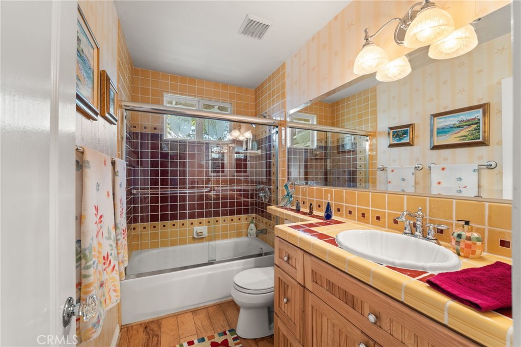 16620 Rocky Glen Road Perris, CA 92570 - Photo 27 of 72 a bathroom with a sink a toilet and shower