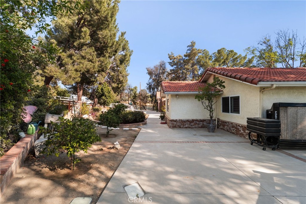 16620 Rocky Glen Road Perris, CA 92570 - Photo 41 of 72 a view of a house with a sitting area and a fire pit