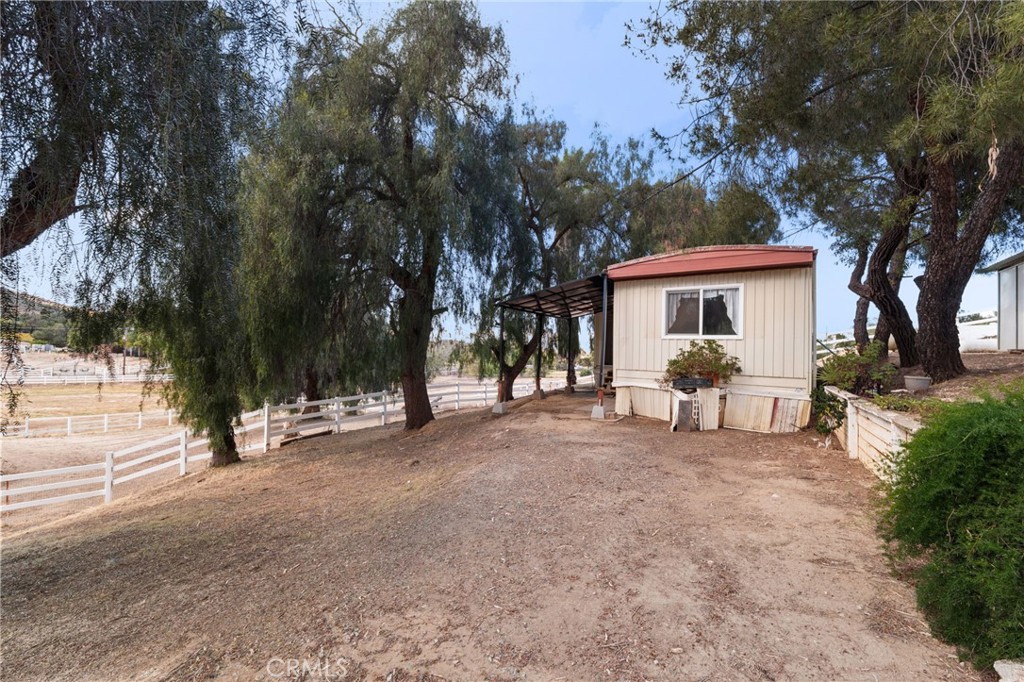 16620 Rocky Glen Road Perris, CA 92570 - Photo 55 of 72 a view of a house with a yard and tree
