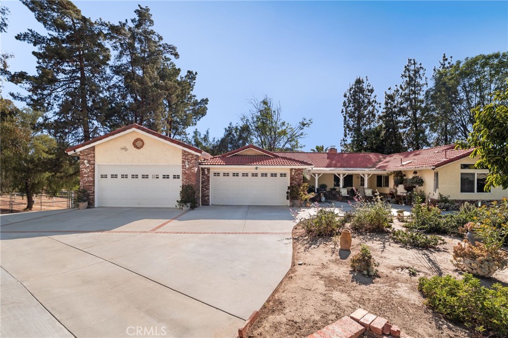 16620 Rocky Glen Road Perris, CA 92570 - Photo 8 of 72 a view of a house with a yard and large tree