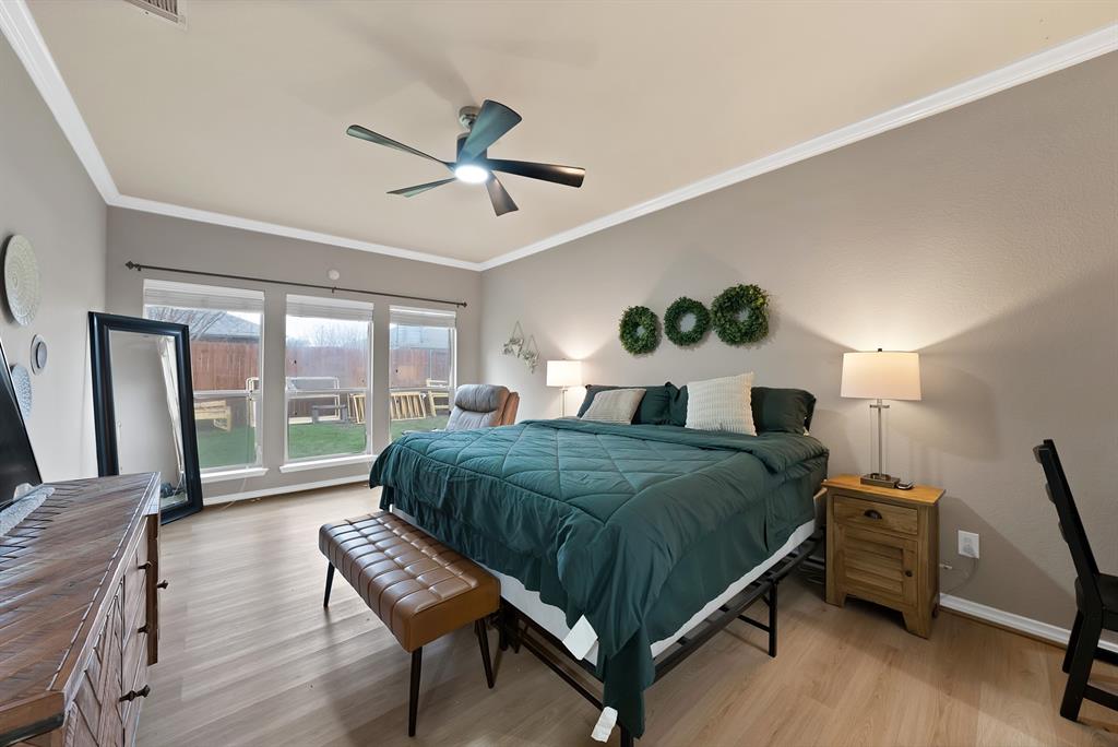 3822 Spring Run Lane Melissa, TX 75454 - Photo 20 of 39 a bedroom with a bed and a large window