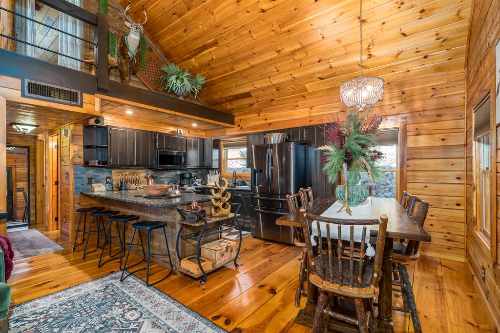 229 Ringtail Run Murphy, NC 28906 - Photo 13 of 68 a view of a dinning tables and chairs in the patio
