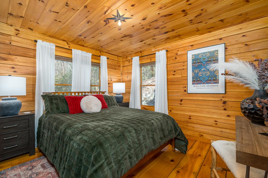 229 Ringtail Run Murphy, NC 28906 - Photo 20 of 68 a bed sitting in a bedroom next to a window