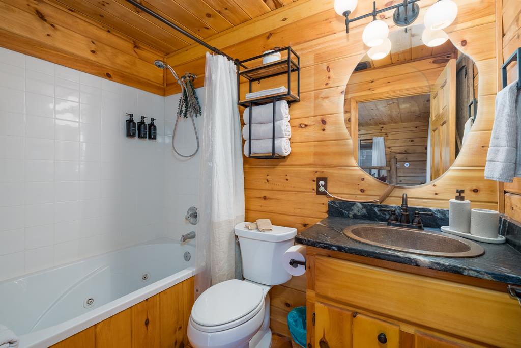229 Ringtail Run Murphy, NC 28906 - Photo 27 of 68 a bathroom with a granite countertop sink toilet and shower