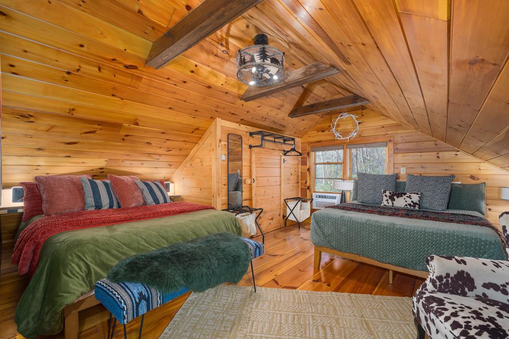 229 Ringtail Run Murphy, NC 28906 - Photo 31 of 68 a living room with a couch wooden floor and a table