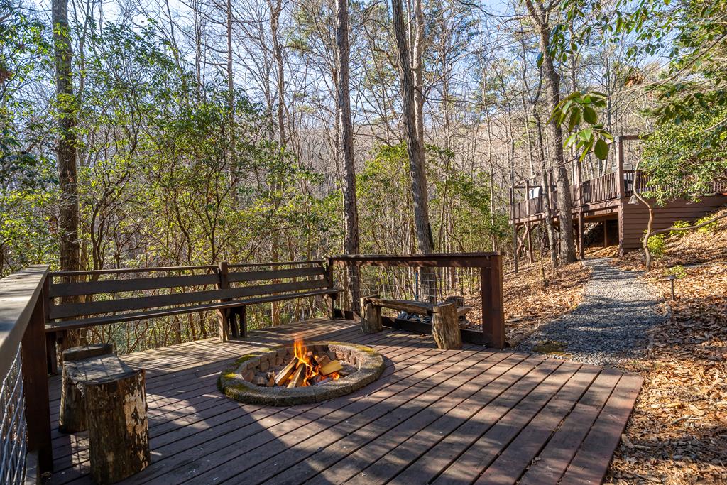 229 Ringtail Run Murphy, NC 28906 - Photo 64 of 68 a view of a wooden deck and a backyard