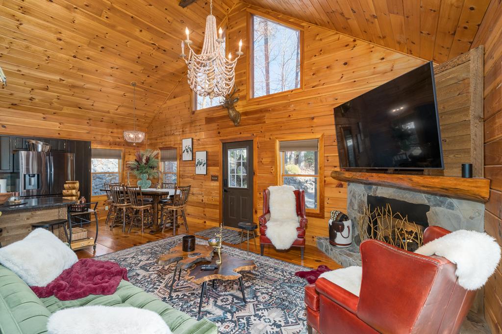 229 Ringtail Run Murphy, NC 28906 - Photo 7 of 68 a outdoor living space with furniture and a flat screen tv