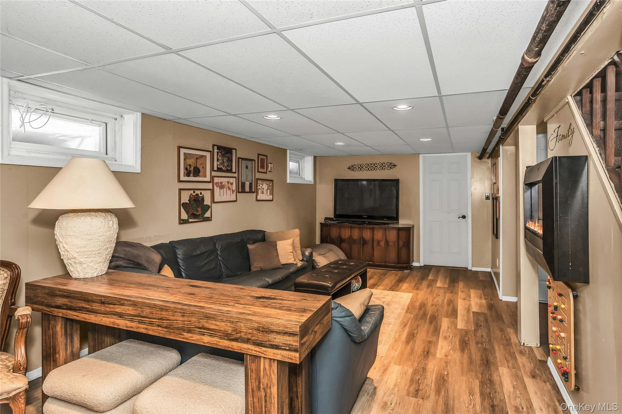 232 Ribbon Street Franklin Square, NY 11010 - Photo 12 of 19 a living room with furniture and a flat screen tv