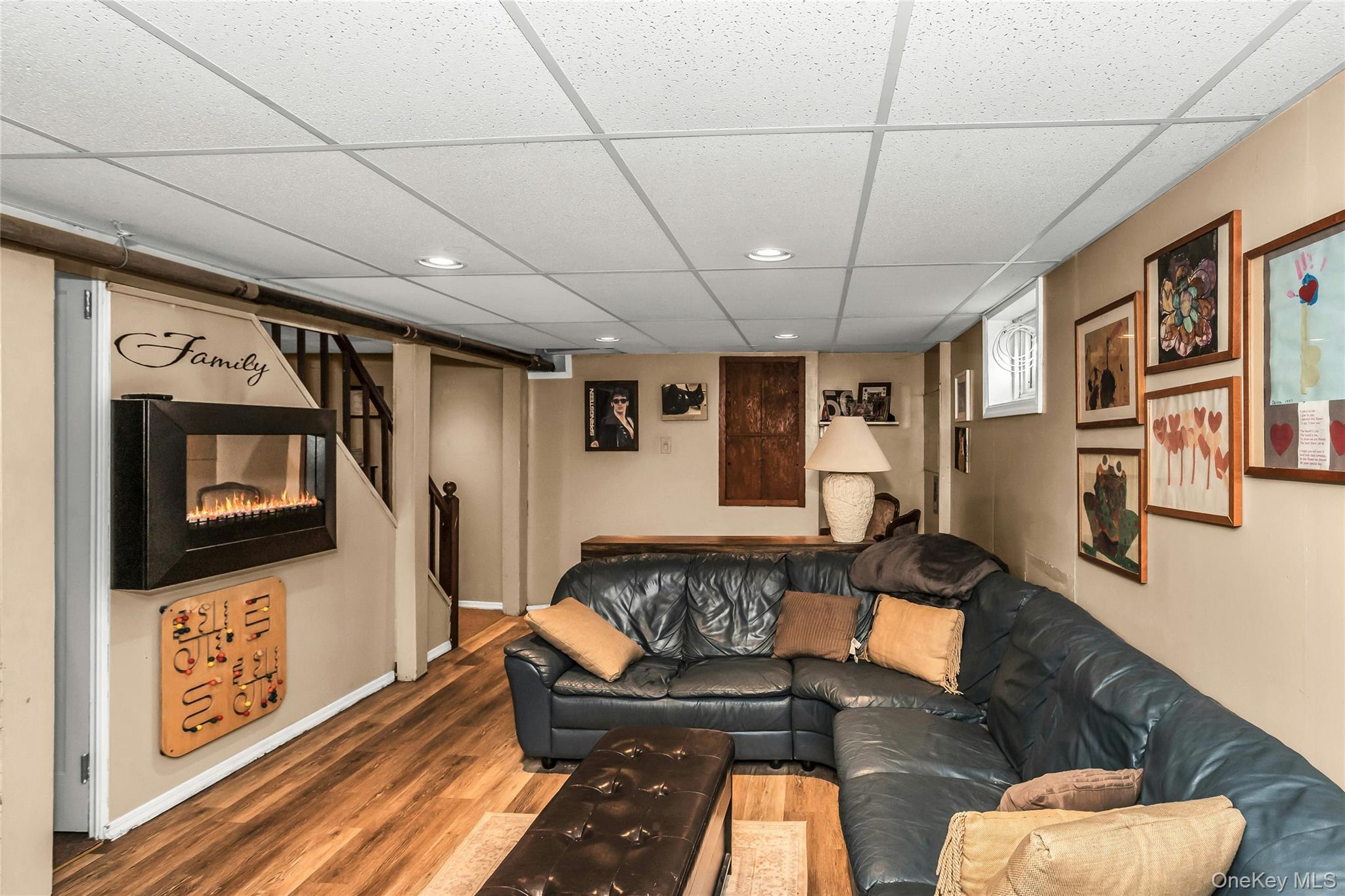 232 Ribbon Street Franklin Square, NY 11010 - Photo 13 of 19 a living room with furniture and a flat screen tv