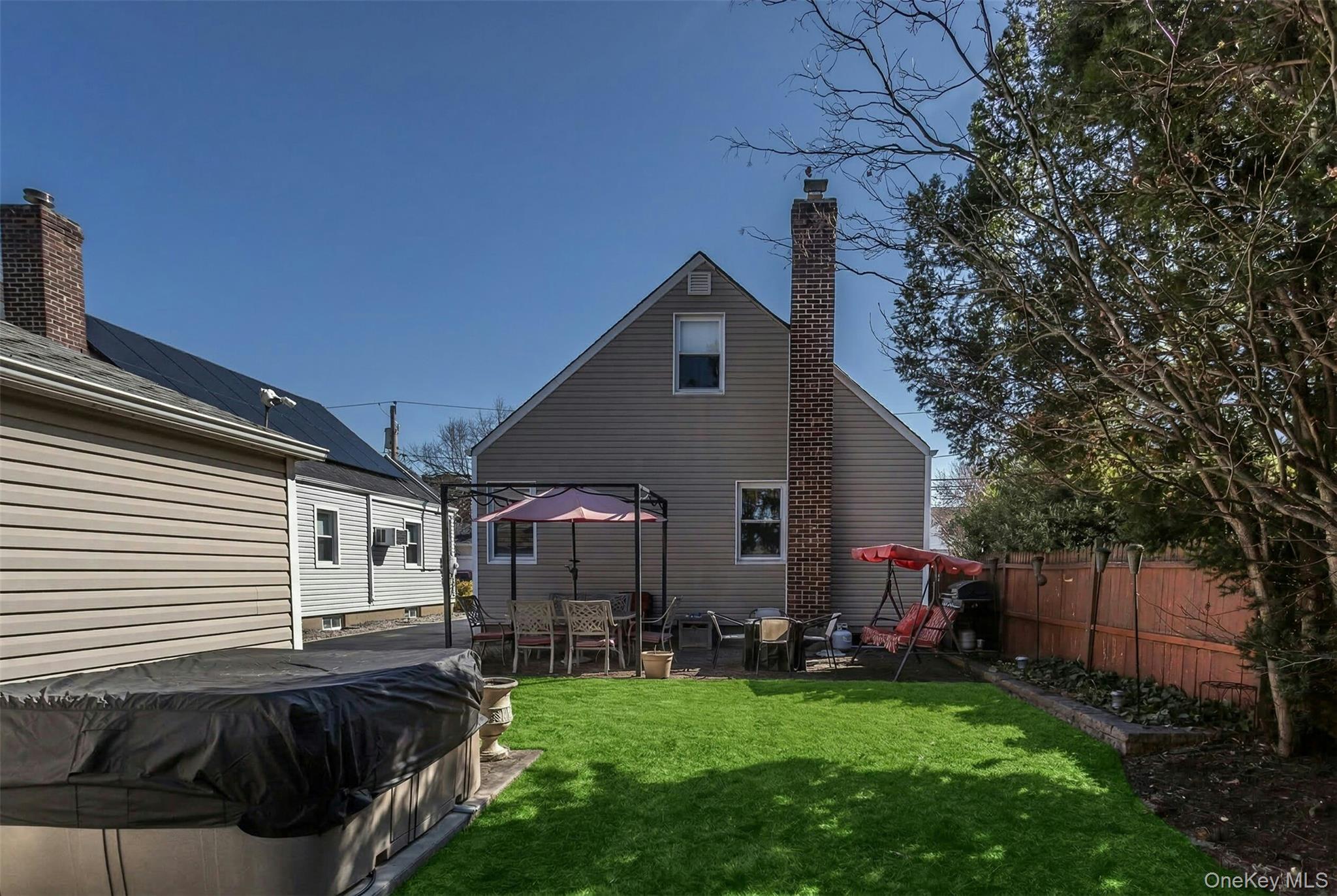 232 Ribbon Street Franklin Square, NY 11010 - Photo 15 of 19 a front view of house with yard and outdoor seating