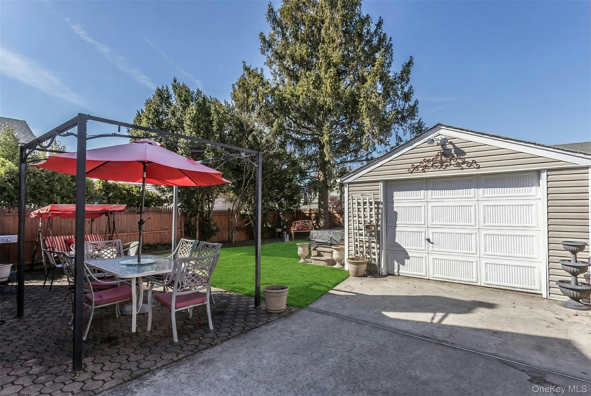 232 Ribbon Street Franklin Square, NY 11010 - Photo 17 of 19 a view of a house with a yard and sitting area
