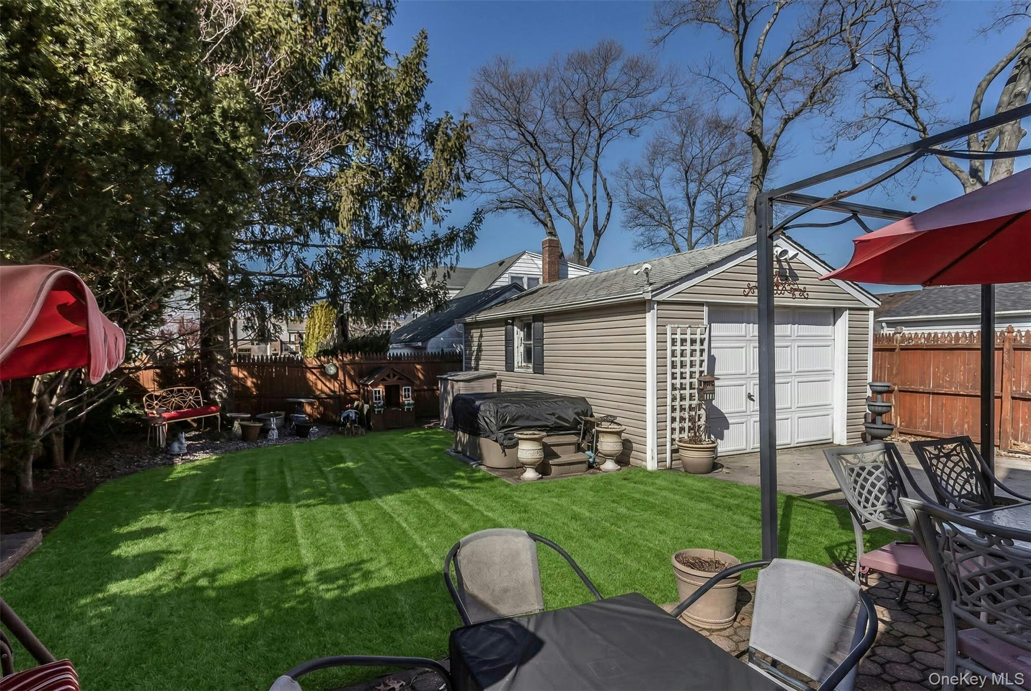 232 Ribbon Street Franklin Square, NY 11010 - Photo 18 of 19 a view of a house with backyard porch and sitting area