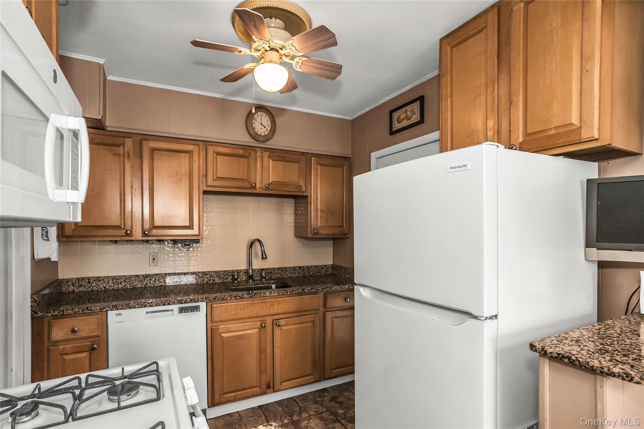 232 Ribbon Street Franklin Square, NY 11010 - Photo 6 of 19 a white refrigerator freezer sitting inside of a kitchen
