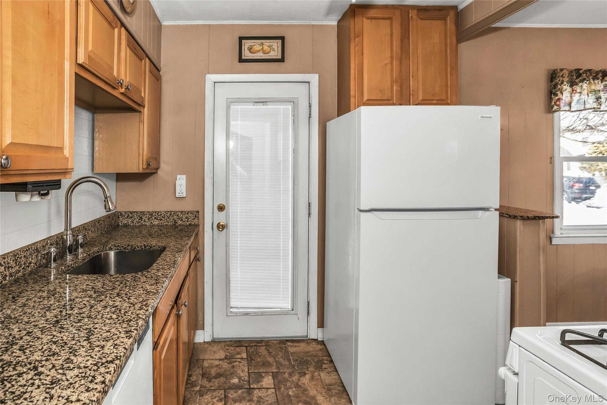232 Ribbon Street Franklin Square, NY 11010 - Photo 7 of 19 a kitchen with a refrigerator and a sink