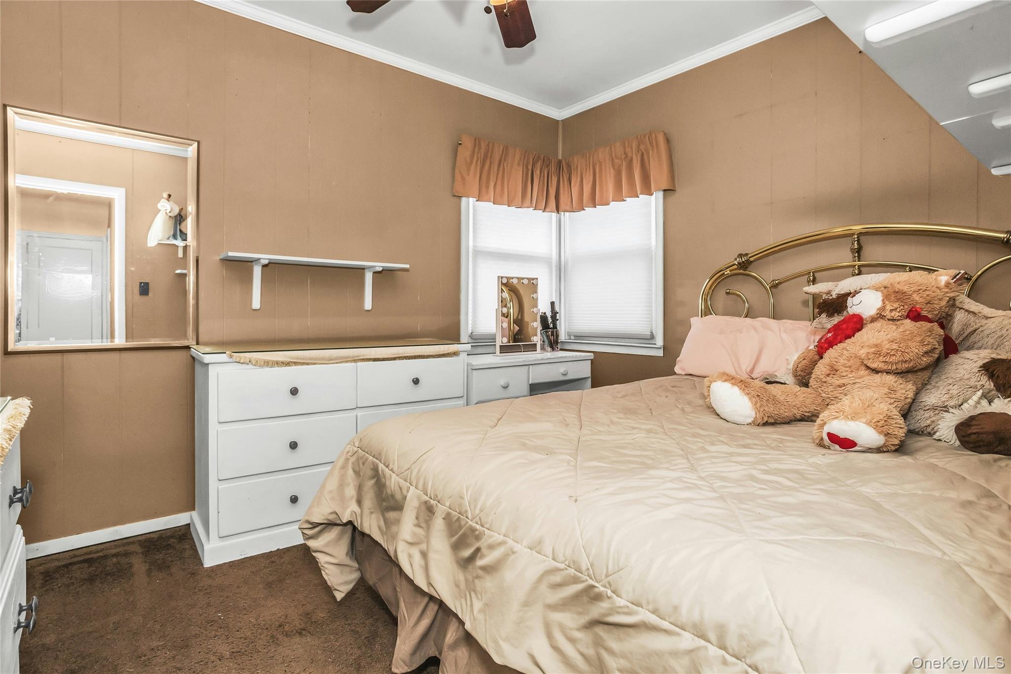 232 Ribbon Street Franklin Square, NY 11010 - Photo 9 of 19 a bedroom with a large bed and a window