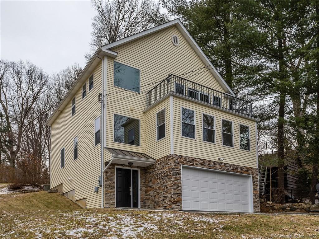18 Boulder Ridge Danbury, CT 06811 - Photo 1 of 1 a front view of a house with a yard