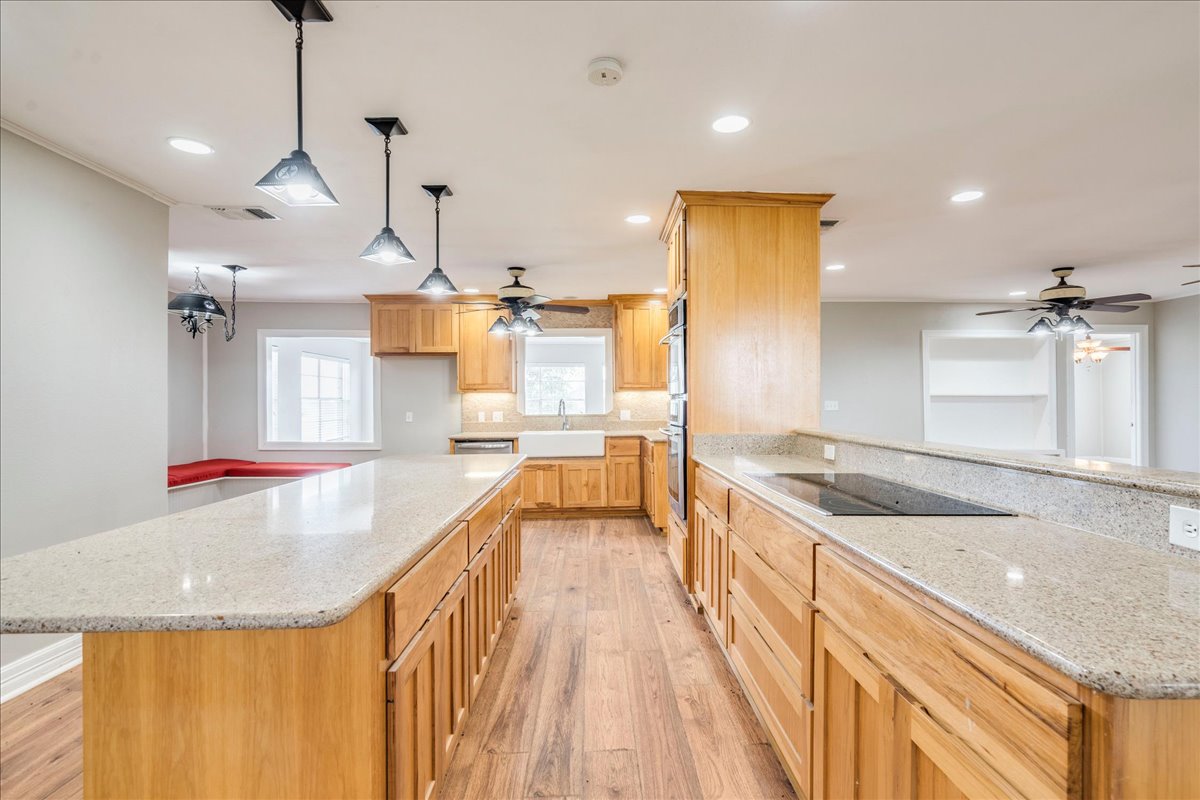 595 Cardinal Road Rosanky, TX 78953 - Photo 9 of 39 a large kitchen with kitchen island a large counter top
