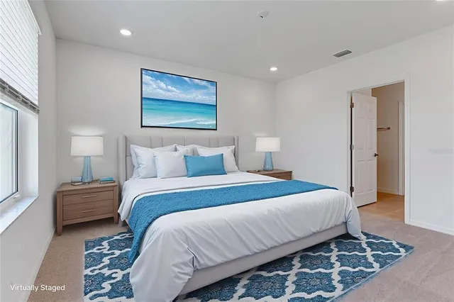 a bedroom with bed and lamps