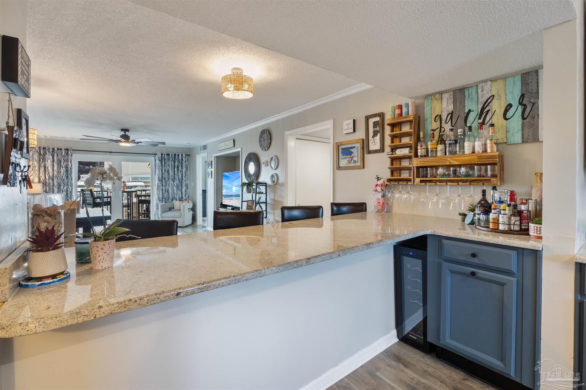 14100 River Road, Unit 122B Perdido Key, FL 32507 - Photo 6 of 46 a kitchen with stainless steel appliances granite countertop a sink and cabinets