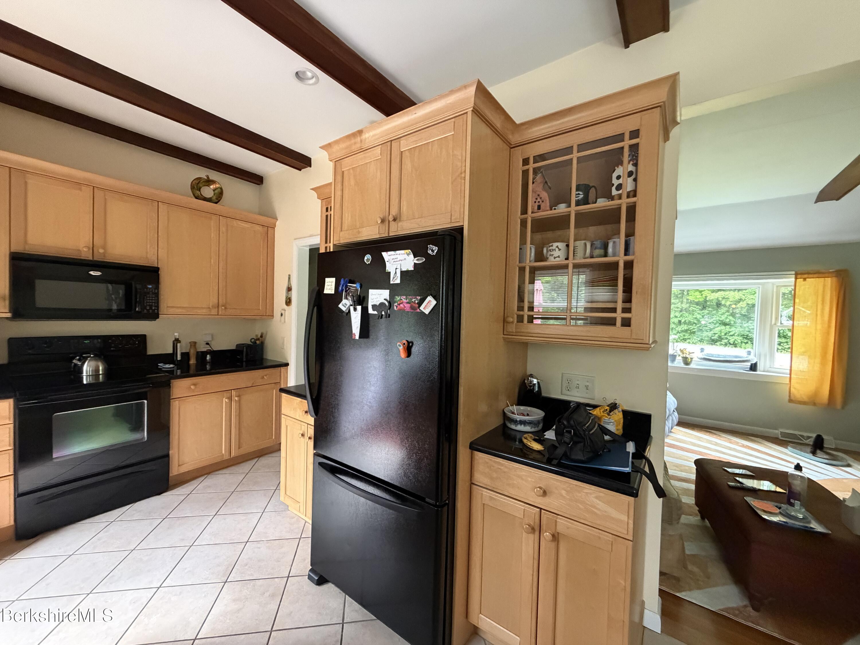20 Sullivan Lane Lenox, MA 01240 - Photo 4 of 23 a kitchen with stainless steel appliances granite countertop a refrigerator stove and sink