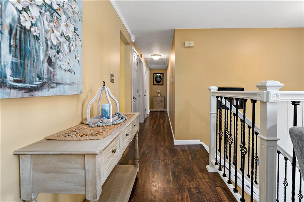 331 Trinity Drive Washington, PA 15301 - Photo 14 of 35 a view of a hallway with wooden floor and staircase