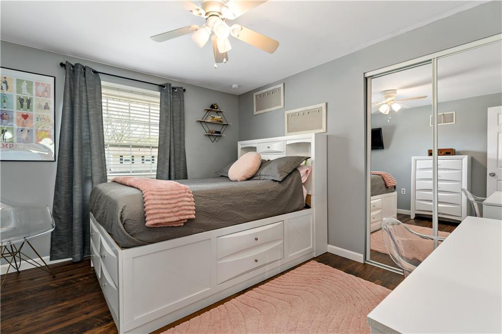 331 Trinity Drive Washington, PA 15301 - Photo 21 of 35 a bedroom with a large bed and a chandelier