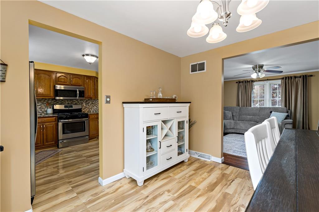 331 Trinity Drive Washington, PA 15301 - Photo 10 of 35 a kitchen with a stove and a wooden floor